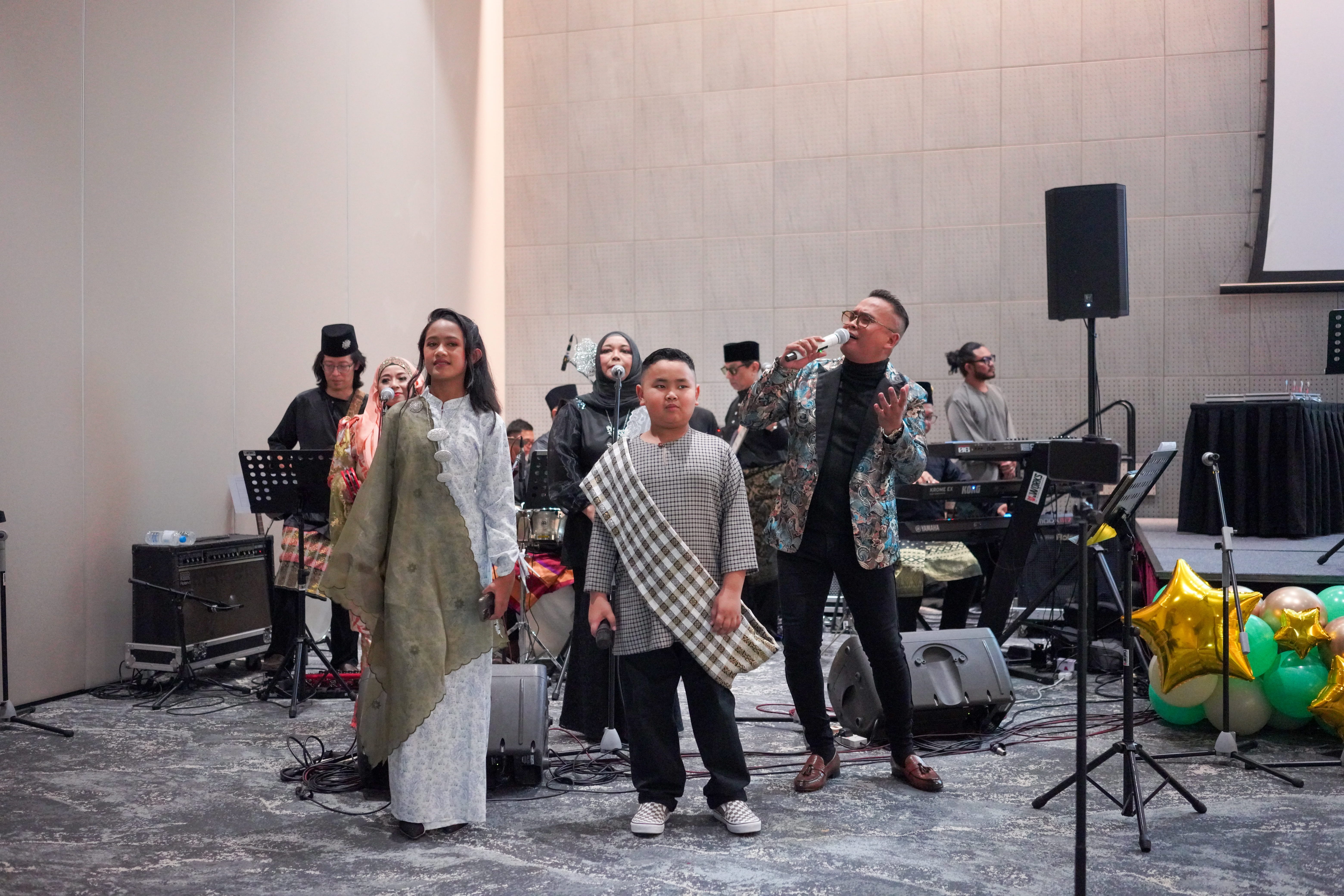 Musicians and singers performing during the entertainment segment of the celebration.